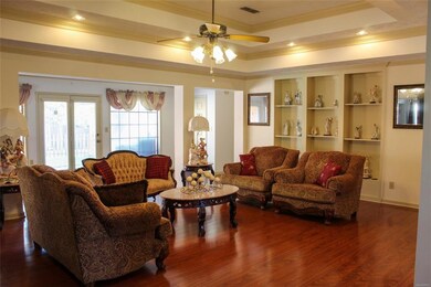 Formal Living Space w/ Trey Ceilings, Built-in She