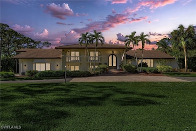 View of front of home featuring a yard and a balco