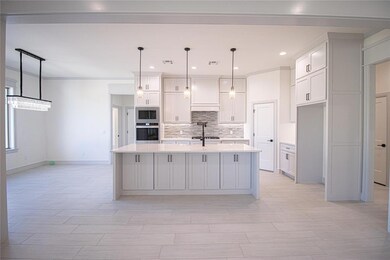 Kitchen with built in microwave, stainless steel o