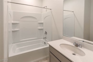 Full bathroom with shower / bathtub combination and vanity