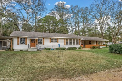 Ranch-style house with a front lawn