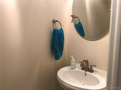 Half bath with new fixtures and tile floors.