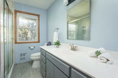 Main floor ¾ bath with a big vanity plus a linen closet.