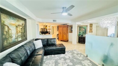 Tiled living room with ceiling fan