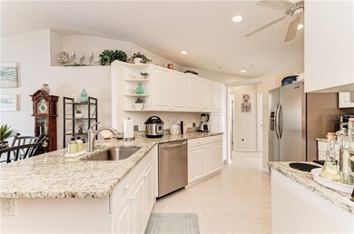Gorgeous clean white kitchen with granite countert