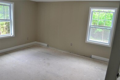 Bedroom, neutral carpet being installed