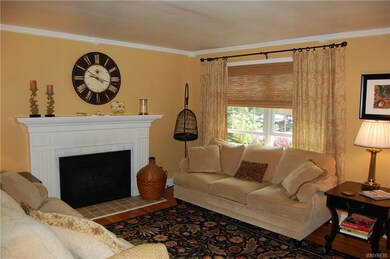 Formal Living Room with hardwood floors, crown mol