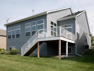 Large deck with stairs to back yard