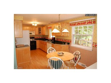Updated kitchen with maple cabinetry.  All applian