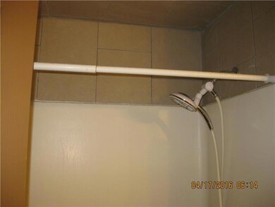 Surround with tile above shower over tub