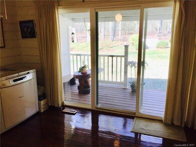 Four season room looking out to covered porch and 