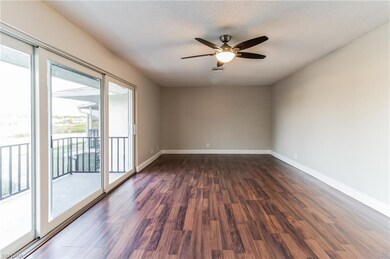 Empty room featuring a textured ceiling, wood-type