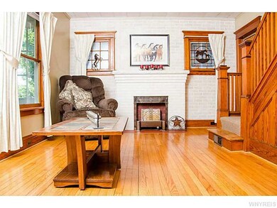 Living Room. Gas fireplace and wood trim staircase