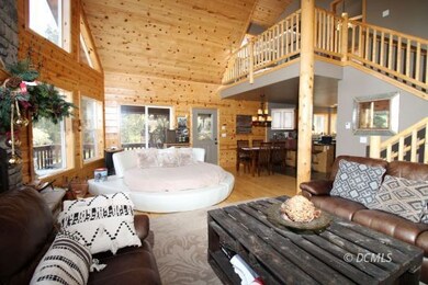 Living area with vaulted ceilings