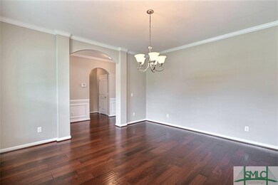 Formal dining room with arch entryway