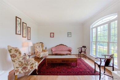 Formal Living Room, an abundance of natural light. Great for entertaining guests! Would make an excellent office.