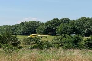plane taking off from airstrip