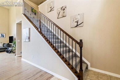 Stairway with light Luxury Vinyl plank flooring an