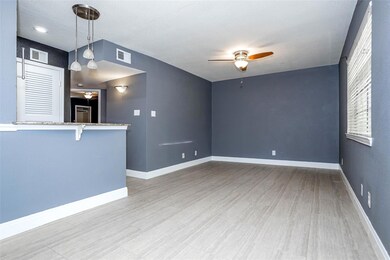 Unfurnished living room with a ceiling fan and wo