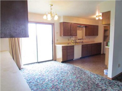 Dining area with a sliding glass door to access th