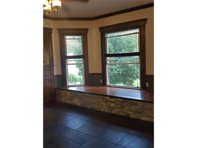 Decorative stone front to the window seat, tiled f