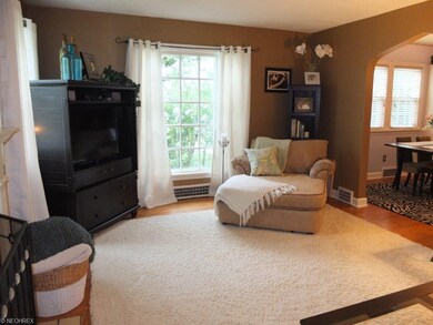 Huge living room with hard wood floors and firepla
