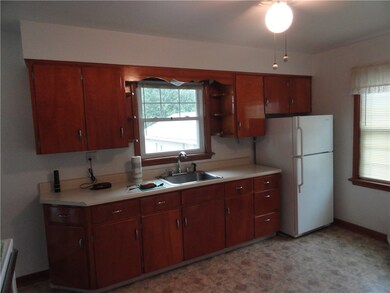 Large eat in kitchen with new flooring and appliances.
