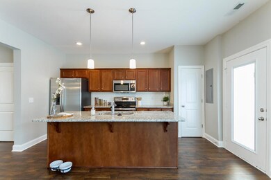 Kitchen with Granite, No Tile Backsplash. Full Stainless Steel Appliance Package