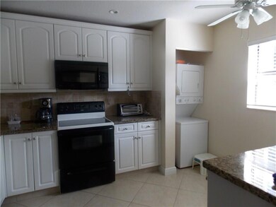 KITCHEN SHOWING STACKED WASHER/DRYER