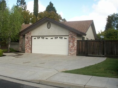 Driveway with extra parking to right.