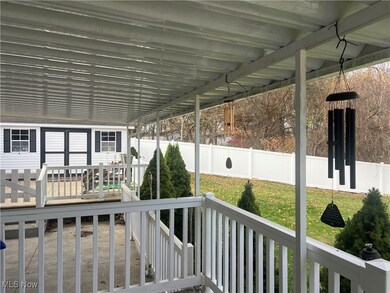 View of double decks with concrete patio between the decks.