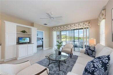 Tiled living room with ceiling fan and a water vie