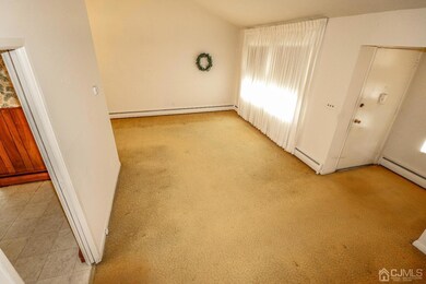 View from the staircase overlooking the living room and foyer.