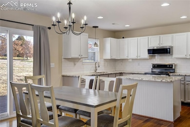 Walk out dining room with modern chandelier