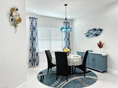 Tiled dining space with a notable chandelier