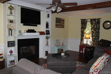 Inviting view of the gas fireplace, bookcases and,