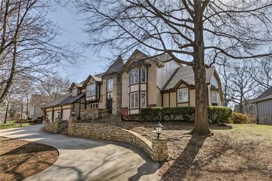 Stately tudor with 3 car garage and circle drive