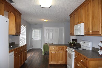Kitchen with Eat-In Area Beyond