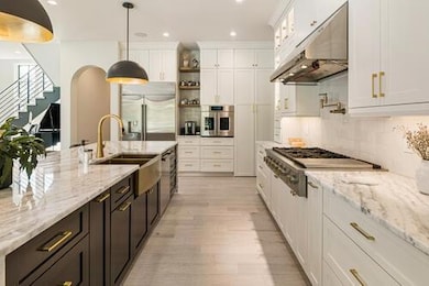 Kitchen with open shelves, white cabinetry, under 