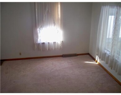 Living Room. Newer Carpeting and original woodwork