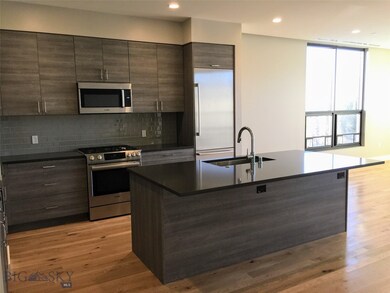Gourmet kitchen with stainless appliances and larg