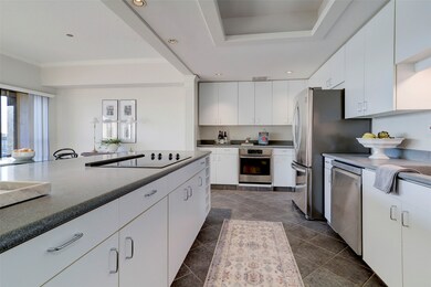 The kitchen has been opened to the living areas wi
