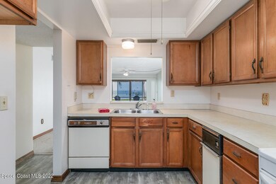 Kitchen overlooks dining and living area