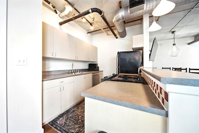 The kitchen that overlooks the living room and breakfast area