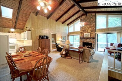Open floor plan with wood ceilings