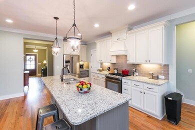 Hurricane pendant lighting, subway tile backsplash and custom, soft-close cabinets ...