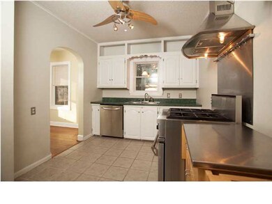 Cute Kitchen with tile flooring