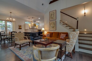 Living room with dark wood-style flooring, a notab