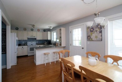 Open kitchen and dining area have...