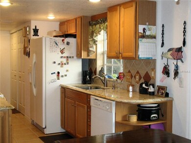Kitchen with granite counters and wood cabinets